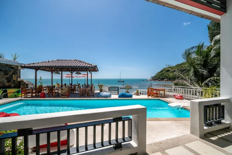 The resort pool and restaurant pavilion looking out over Silver Beach