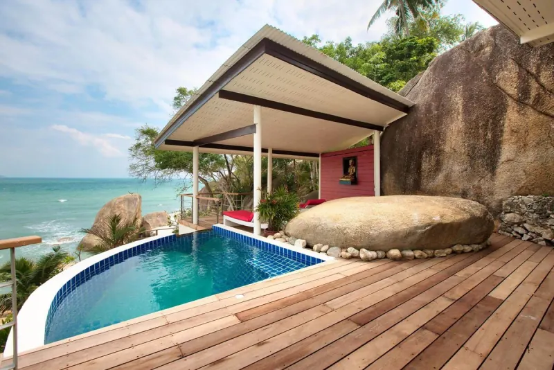 Private Pool Villa — plunge pool and deck built around the granite boulders above the sea