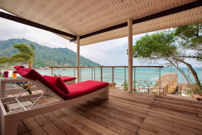 Shaded sala with a day bed overlooking the bay
